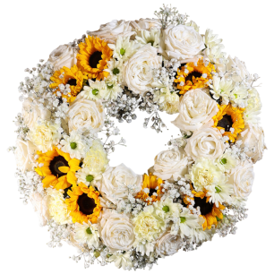 En krans av vita rosor, gula solrosor och små vita blommor arrangerade i en cirkel.